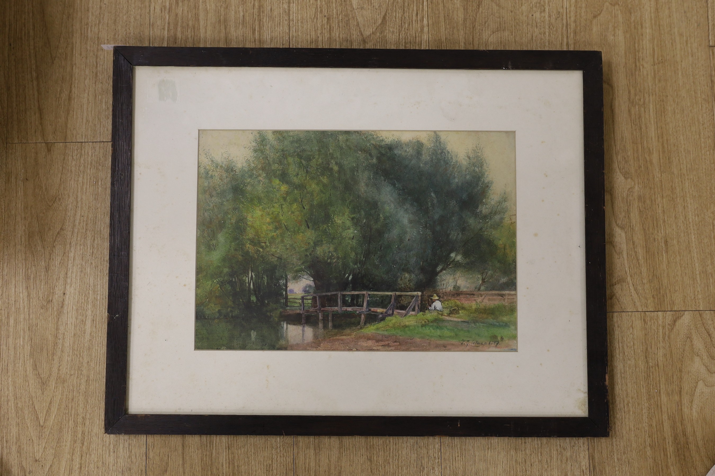 Frederick George Cotman (1850-1920), watercolour, Angler seated beside a wooden footbridge, signed and dated 1887, 27 x 39cm